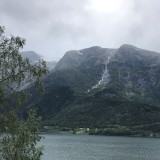 Waterfall and glacier at the fjord